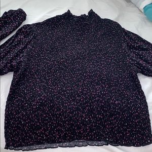Black floral smocked shirt.